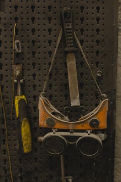 Protective eyewear and tool in garage