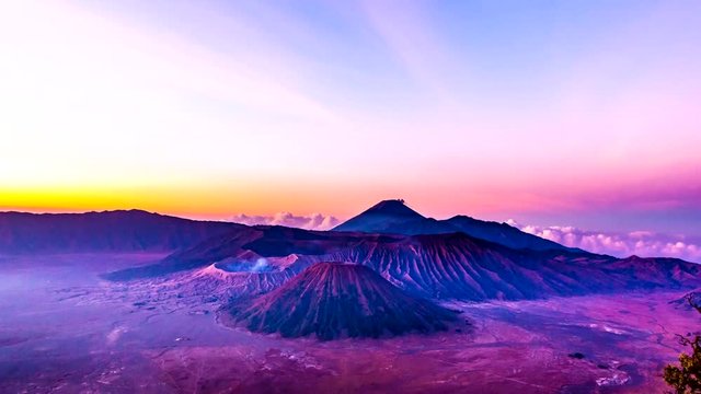 Time lapse Sunrise at Mount Bromo volcano beautiful landscape landmark and popular destinations, the magnificent view of Mt. Bromo located in Bromo Tengger Semeru National Park, East Java, Indonesia.