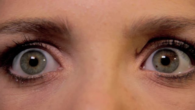Female eyes popping open.