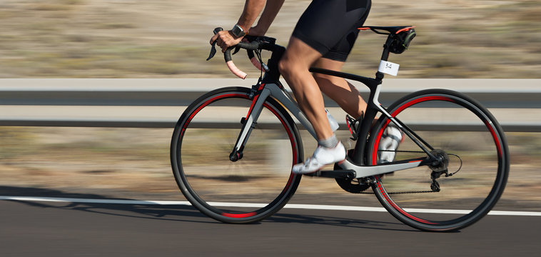 Motion blur of a bike race with the bicycle and rider at high speed