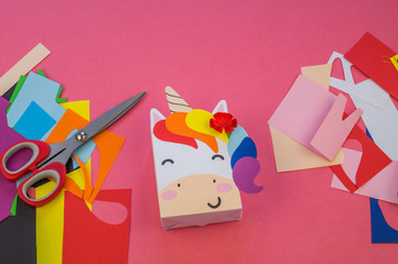 Unicorn of paper on a pink background
