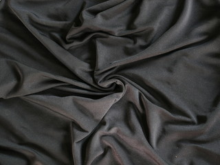 Fototapeta premium Black silk fabric texture background