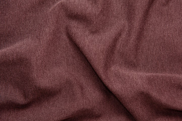 Obraz premium Red wine-colored fabric texture for background