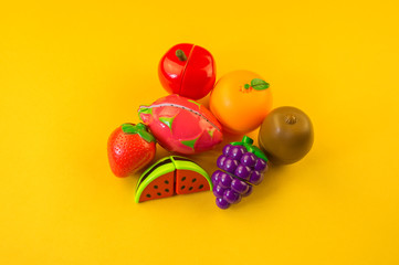 Children's toy plastic fruit in a basket