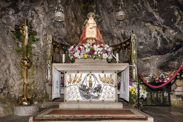 Spain, Asturias, Picos de Europa, Covadonga: Detail of Virgin Mary shrine in the Hermitage of The Holy Cave of Covadonga (Santa Cueva) a famous Spanish sanctuary - concept religion pilgrimage travel