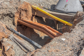 Urban supply lines for electricity, water, sewage, telephone and more. Concept: prevention or technology