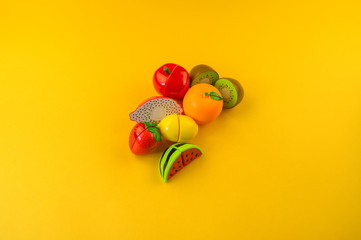 Children's toy plastic fruit in a basket