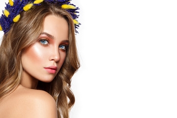 Beautiful woman portrait with flower wreath on head.