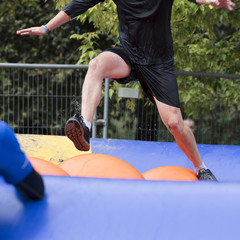 Participant tackles an adventure obstacle course race