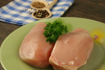 Raw chicken breast and spices close up. Selective focus