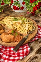 Chicken nuggets with yellow beans.