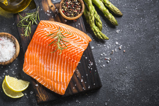 Salmon fillet with ingredients for cooking -  fresh vegetables a