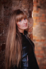 Naklejka premium Portrait of a beautiful, dreamy and sad girl with long hair autumn