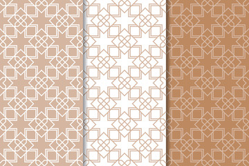 Set of geometric ornaments. Brown and white seamless patterns