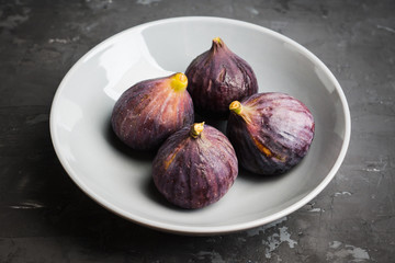Fresh ripe figs on the rustic background. Selective focus. Shallow depth of field.