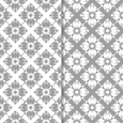 White and gray floral ornamental designs. Set of seamless patterns