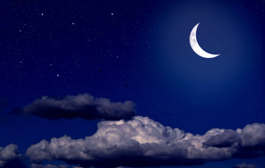 Obraz na płótnie Canvas Stars, moon and cumulonimbus in the night sky