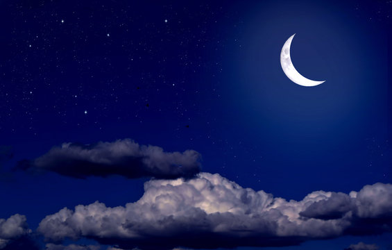 Stars,  moon and cumulonimbus in the night sky