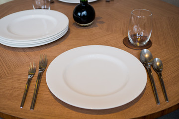 restaurant glass of water on table, dish and spoon