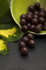 chocolate dragee on black slate