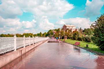 magical autumn landscape in the park with benches in the puddles on the promenade of Ternopil after heavy rain, Ukraine. amazing places. popular tourist atraction