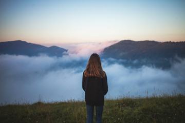 Teen Girl in Misty Mountains