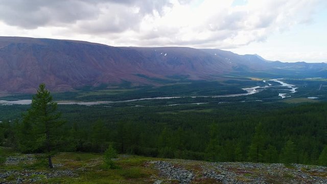 View of the valley of the river Sob, gloomy August day (aerial video). Polar Urals, Russia   
