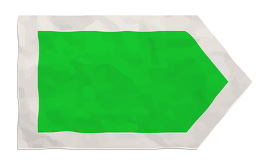 green arrow on crumpled paper