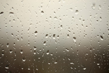  Window with drops of rain on the glass, autumn landscape