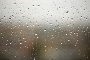  Window with drops of rain on the glass, autumn landscape