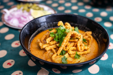 Northern Thai food of Coconut curry noodle soup with chicken (Khao Soi)
