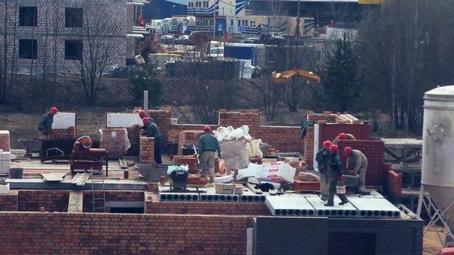 The crane lowers the deck block on the building's construction. Time Lapse