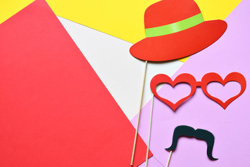Colorful props for party. Carnival accessories set. Paper glasses, hat, lips, moustaches, tie on...