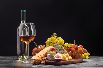 Wine and cheese on the table