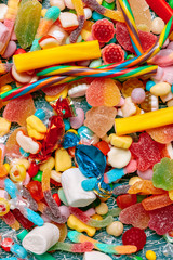 Fototapeta na wymiar Colorful candies on old background