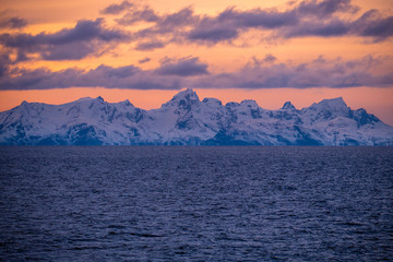 Fototapeta na wymiar Norway landscape view during sunset from the boat to the coast