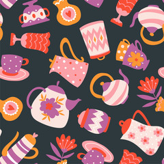 Floral Tea seamless pattern. Cute fabric design. Teapots, cups and flowers isolated on the dark background.