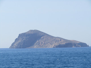 Fototapeta na wymiar Capdolo island and waves and rocks