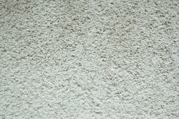 Textural background of light plaster.