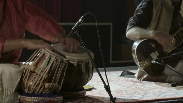 Playing on tabla and sitar