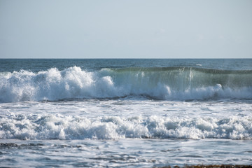 Wave crashing on coastline