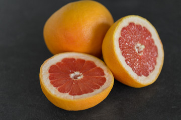 food, fruits and healthy eating concept - close up of fresh juicy grapefruits
