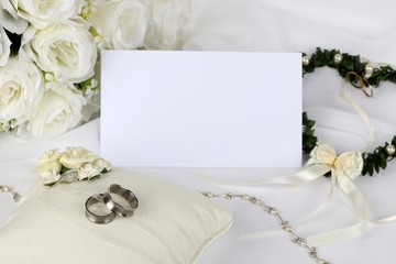 wedding invitation - blank wedding invitation with wedding rings and  white roses 