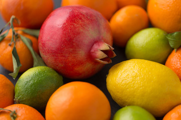 food, healthy eating and vegetarian concept - close up of citrus fruits
