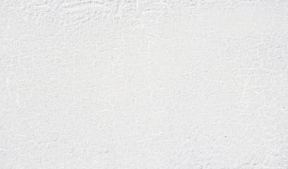 White abstract background with cracked paint on surface. Weathered woden plate with white enamel.