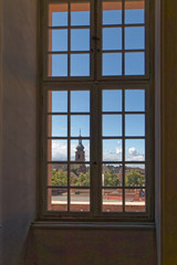 View through the antique window to the old city.
