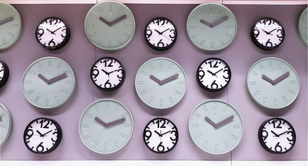 Various Designs of Clocks Hanging on the Wall