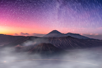 Mount active volcano, Batok, Bromo, Semeru with starry and fog at dawn