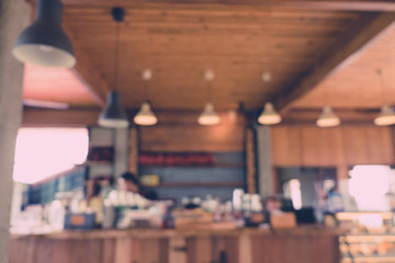 Abstract blur image of Counter in the coffee shop with bokeh for background usage.