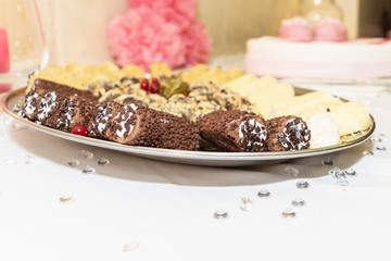 A scrumptious plate of chocolate dipped Cannoli with chocolate chips. A yummy treat for any sweet tooth. Horizontal. blurrey background.